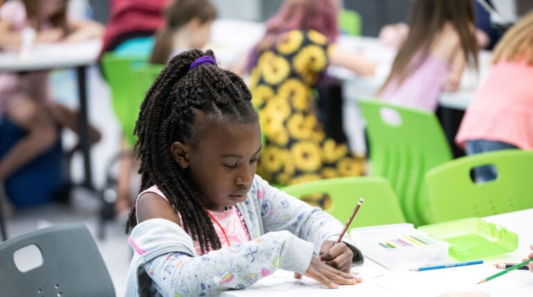 Girl working in science center