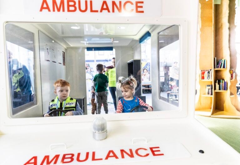 Boy and girl in an ambulance in KidsPlace