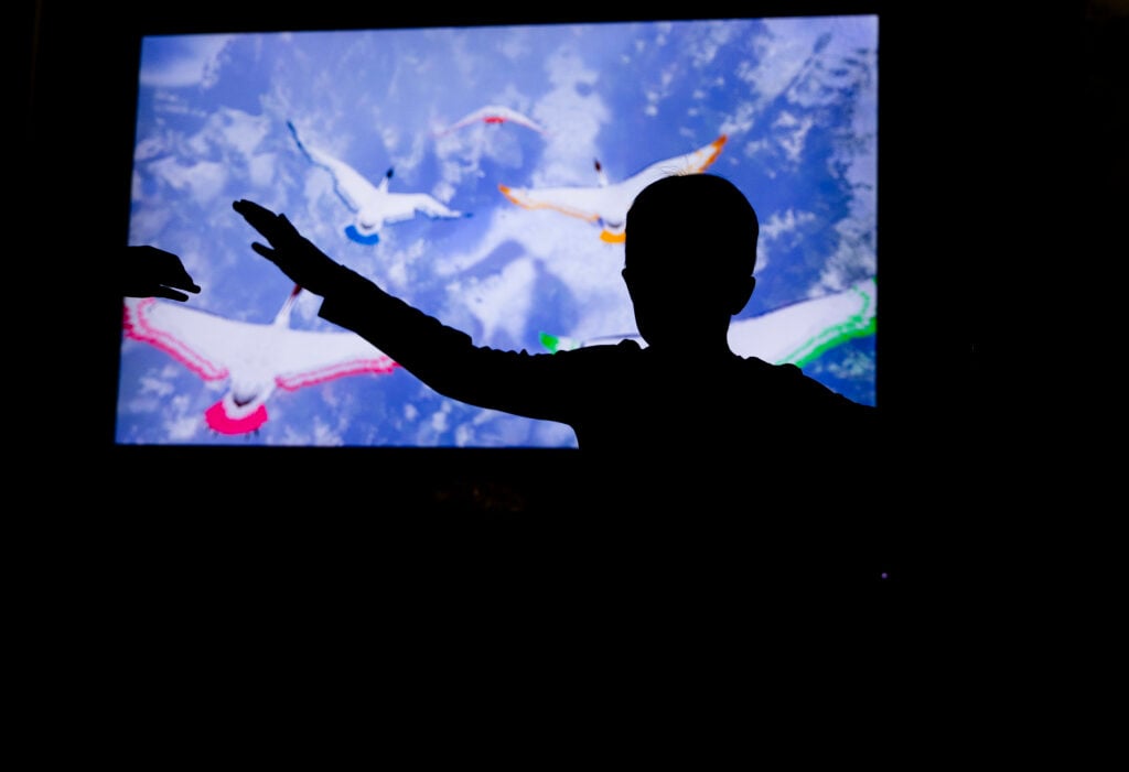 A child explores a flight feature at Above And Beyond, presented by TE Connectivity. Photo by Sean Simmers.